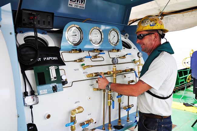 Dive supervisor at the air panel
