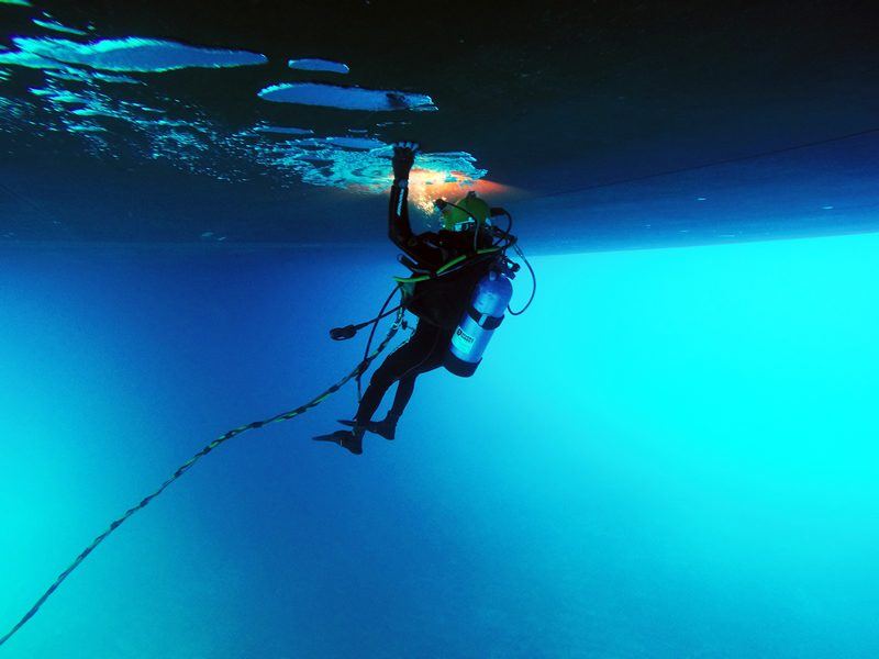 Diver cleaning a ship's hull